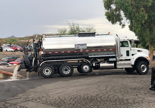 A Granulated Rubber Asphalt Distributor getting cleaned out
