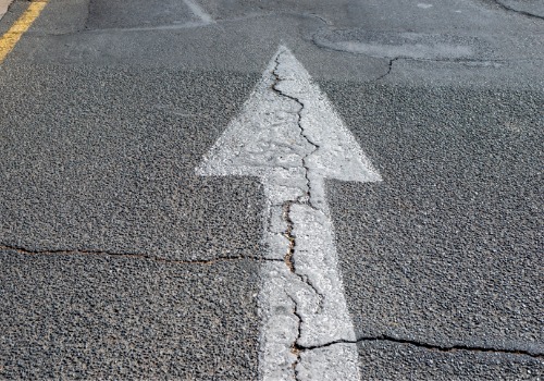 cracked asphalt road pavement in Texas